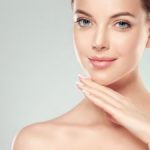 beautiful woman touching her face