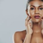 Young Woman Feeling Her Facial Skin Atlanta GA