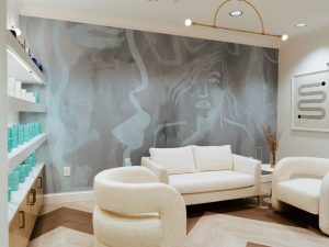 A waiting area and a display shelf with skincare products offered for sale at The K Spa in Atlanta GA.