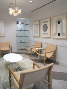 A waiting area and a display shelf with skincare products offered for sale at The K Spa in Atlanta GA.