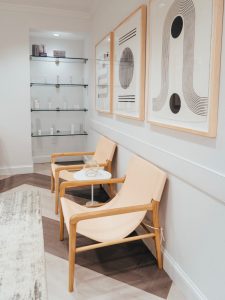 A waiting area and a display shelf with skincare products offered for sale at The K Spa in Atlanta GA.
