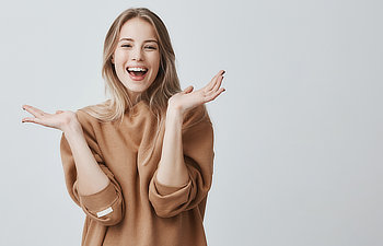 beautiful woman with blonde long hair looking at camera having excited and happy facial expression Atlanta, GA